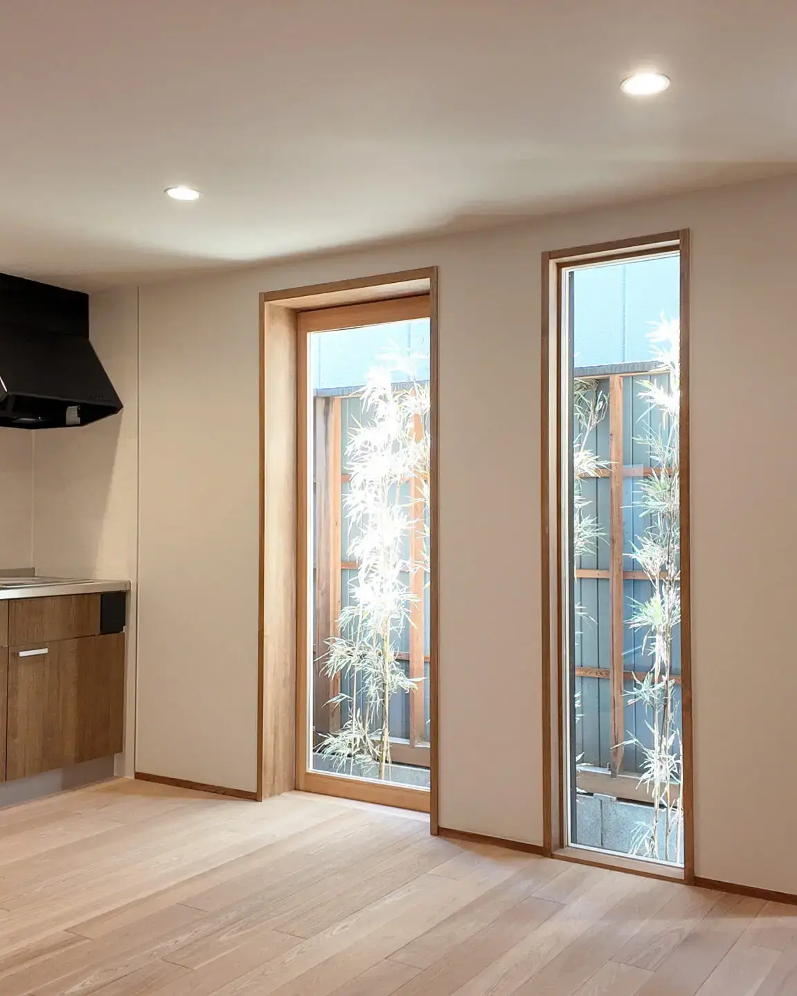 Bright living area with floor-to-ceiling windows in Small Gojo
