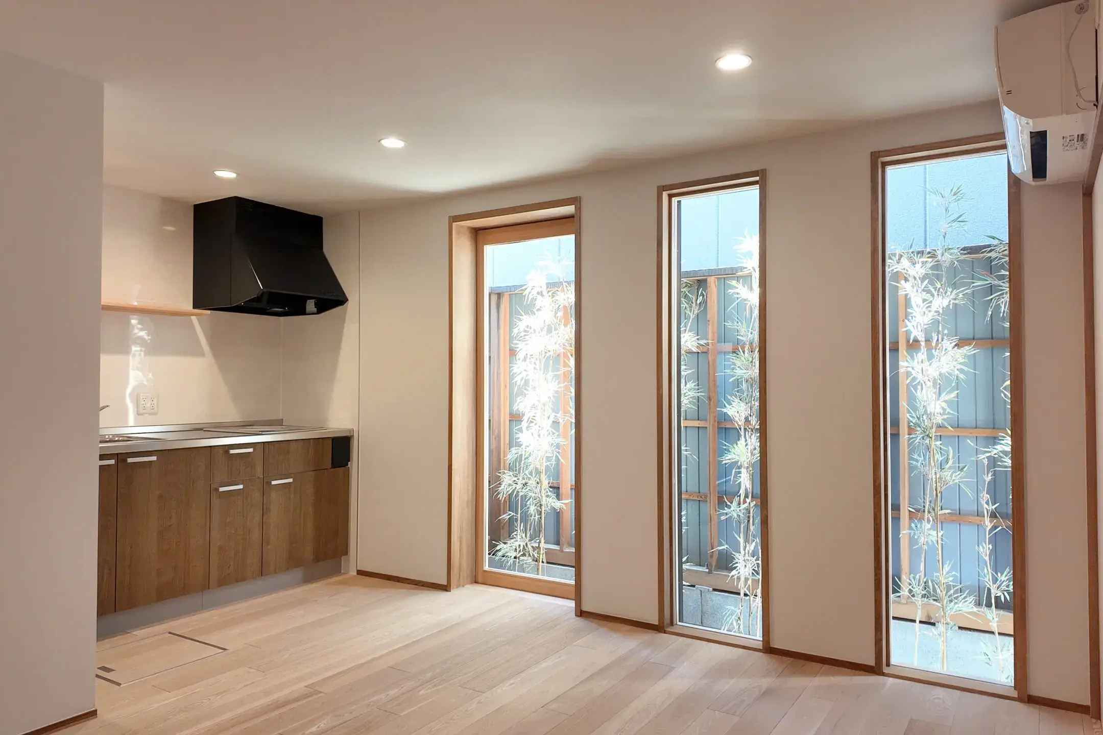 Bright living area with floor-to-ceiling windows in Small Gojo